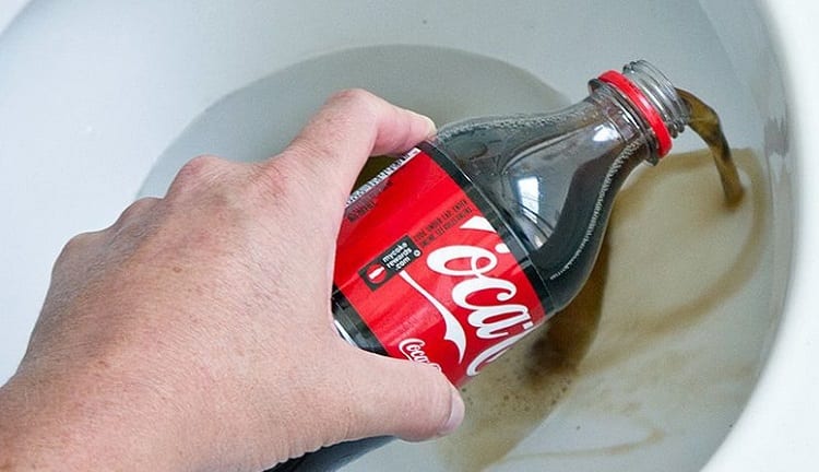 Pouring Coke Into Toilet