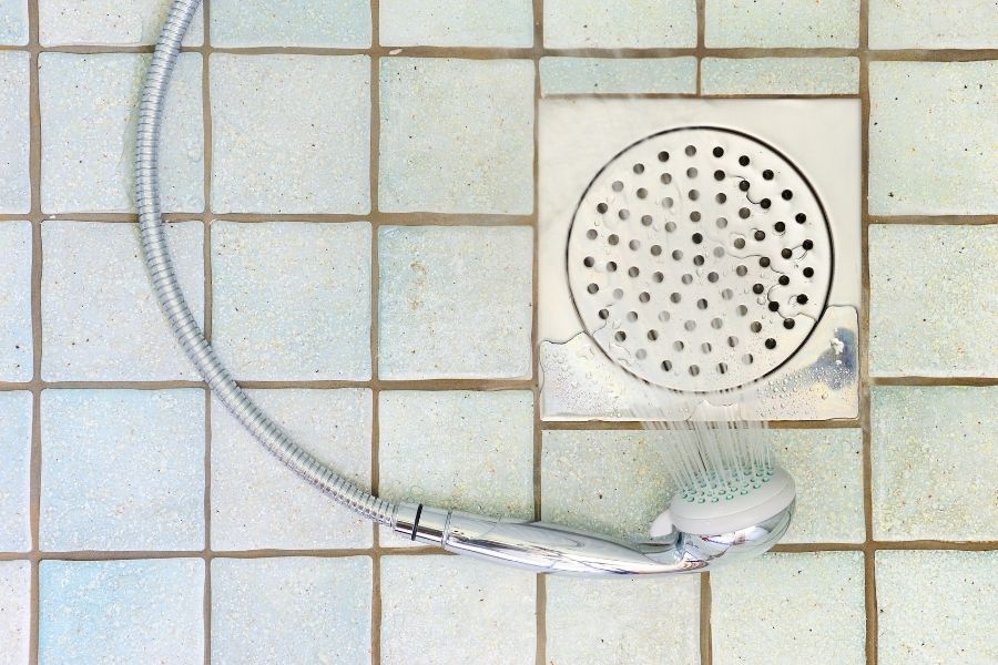 shower head next to drain
